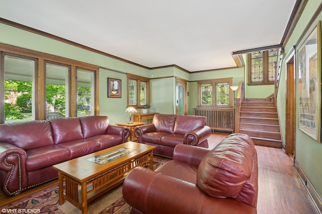 500 Fair Oaks Ave, Oak Park, IL 60302 - living room featuring radiator heating unit, wood finished floors, stairway, and ornamental molding