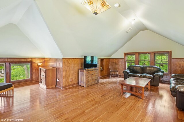 500 Fair Oaks Ave, Oak Park, IL 60302 - living room featuring lofted ceiling, light wood-type flooring, wood walls, and wainscoting