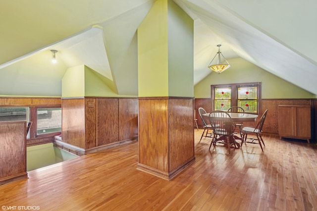 500 Fair Oaks Ave, Oak Park, IL 60302 - dining space featuring lofted ceiling, wainscoting, hardwood / wood-style floors, and wooden walls