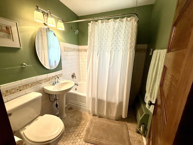 500 Fair Oaks Ave, Oak Park, IL 60302 - bathroom featuring tile walls, shower / tub combo with curtain, a wainscoted wall, and tile patterned floors