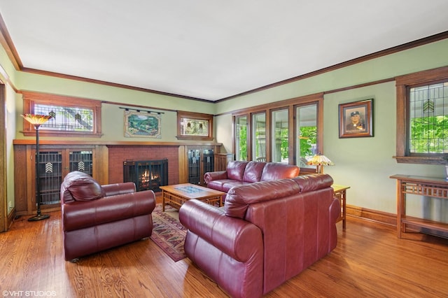 500 Fair Oaks Ave, Oak Park, IL 60302 - living room featuring wood finished floors, healthy amount of natural light, a brick fireplace, and crown molding