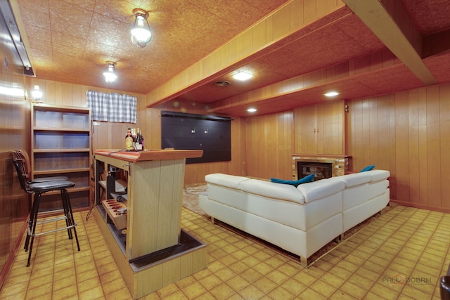 80 N Lake Ave, Third Lake, IL 60030 - living room with wood walls, a glass covered fireplace, bar, and light flooring