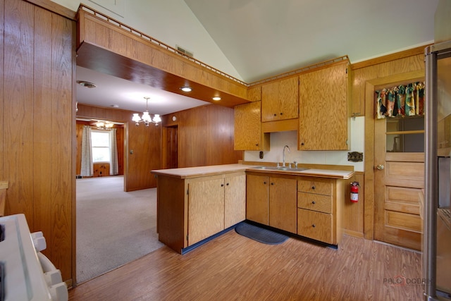 80 N Lake Ave, Third Lake, IL 60030 - kitchen with light countertops, vaulted ceiling, a chandelier, a peninsula, and range
