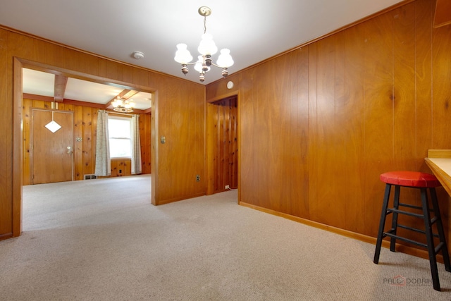 80 N Lake Ave, Third Lake, IL 60030 - unfurnished dining area featuring a chandelier, carpet flooring, and wooden walls