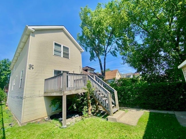 9159 S Dobson Ave, Chicago, IL 60619 - back of property featuring a yard, a wooden deck, and stairs
