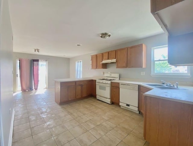 9159 S Dobson Ave, Chicago, IL 60619 - kitchen with white appliances, a peninsula, under cabinet range hood, and healthy amount of natural light