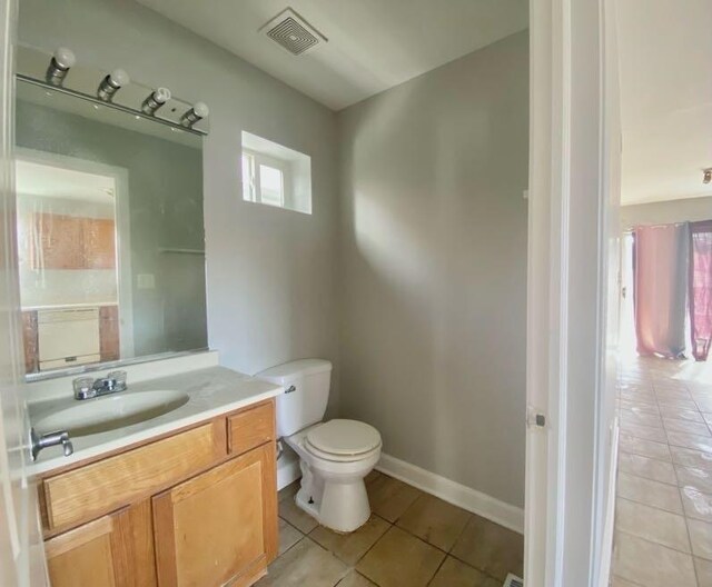 9159 S Dobson Ave, Chicago, IL 60619 - half bathroom featuring tile patterned flooring and vanity