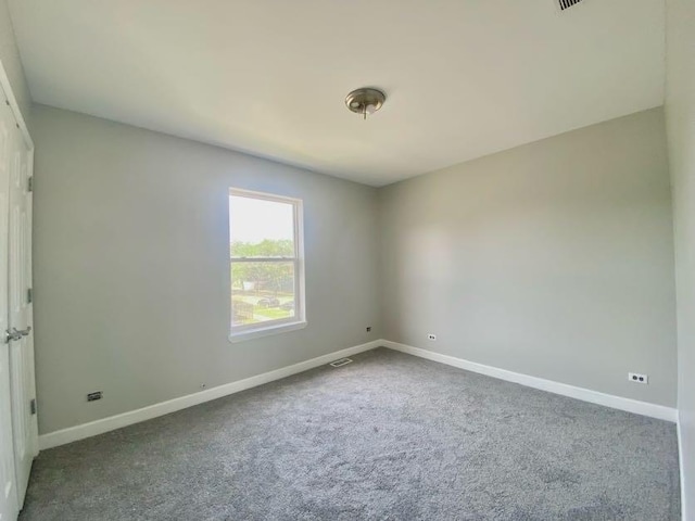 9159 S Dobson Ave, Chicago, IL 60619 - carpeted spare room featuring baseboards