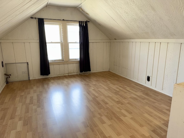 826 S E Ave, Oak Park, IL 60304 - bonus room featuring light wood-style flooring, lofted ceiling, and a decorative wall