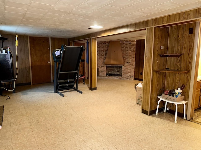 826 S E Ave, Oak Park, IL 60304 - exercise room with wood walls, light flooring, and a fireplace