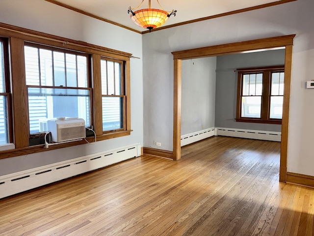 826 S E Ave, Oak Park, IL 60304 - empty room with baseboard heating, hardwood / wood-style floors, and crown molding