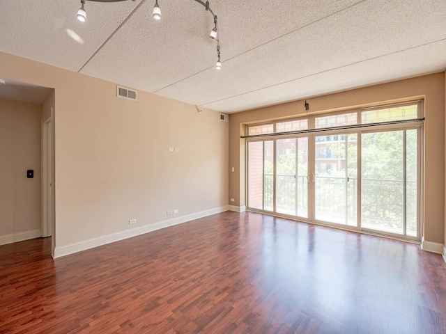 1670 Mill St Unit 208, Des Plaines, IL 60016 - empty room with wood finished floors, a textured ceiling, and track lighting
