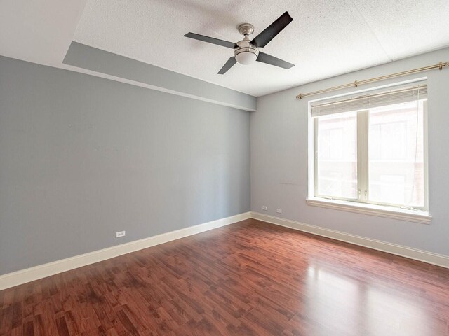 1670 Mill St Unit 208, Des Plaines, IL 60016 - unfurnished room with dark wood-type flooring, a ceiling fan, and a textured ceiling