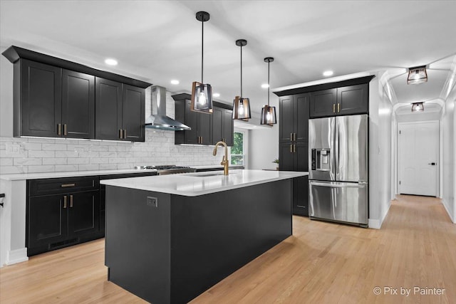 27W075 Fleming Dr, Winfield, IL 60190 - kitchen featuring stainless steel refrigerator with ice dispenser, wall chimney range hood, dark cabinetry, light countertops, and backsplash