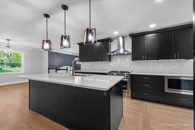 27W075 Fleming Dr, Winfield, IL 60190 - kitchen featuring wall chimney exhaust hood, stainless steel appliances, dark cabinetry, light countertops, and recessed lighting