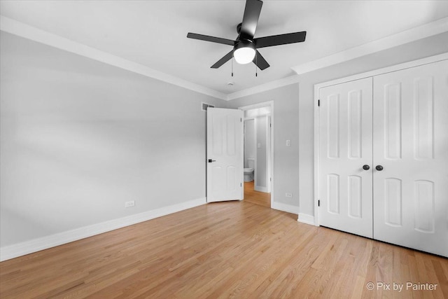 27W075 Fleming Dr, Winfield, IL 60190 - unfurnished bedroom with light wood finished floors, crown molding, a closet, and a ceiling fan