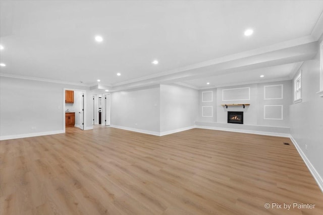 27W075 Fleming Dr, Winfield, IL 60190 - unfurnished living room with recessed lighting, light wood-style floors, crown molding, and a glass covered fireplace