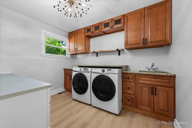 27W075 Fleming Dr, Winfield, IL 60190 - laundry room with independent washer and dryer, light wood-style flooring, cabinet space, and a chandelier