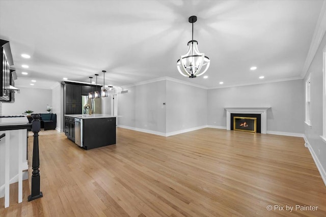 27W075 Fleming Dr, Winfield, IL 60190 - unfurnished living room featuring a chandelier, recessed lighting, light wood-type flooring, crown molding, and a lit fireplace