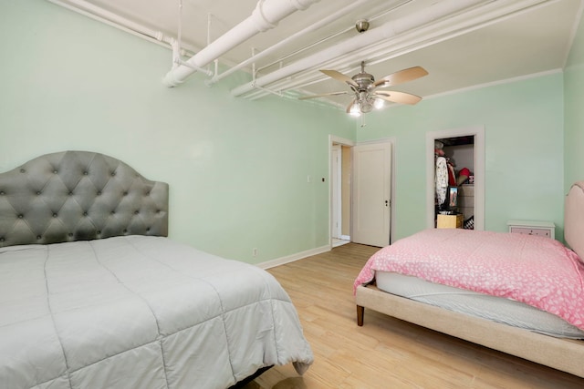 1360 E Madison Park Unit B, Chicago, IL 60615 - bedroom with wood finished floors, a walk in closet, ceiling fan, and a closet