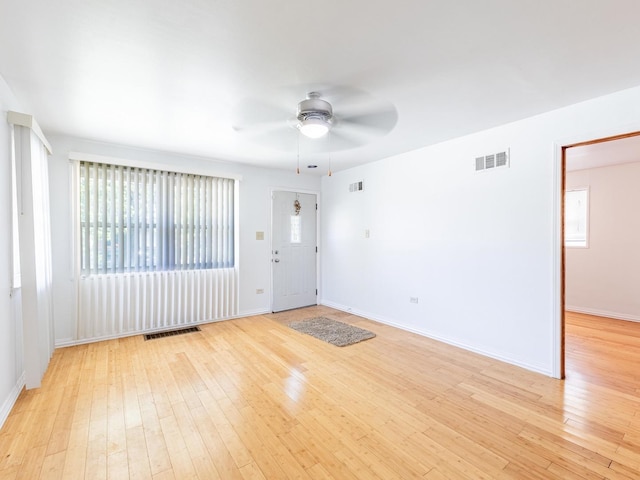 14732 Dorchester Ave, Dolton, IL 60419 - unfurnished room featuring ceiling fan and light wood-style floors