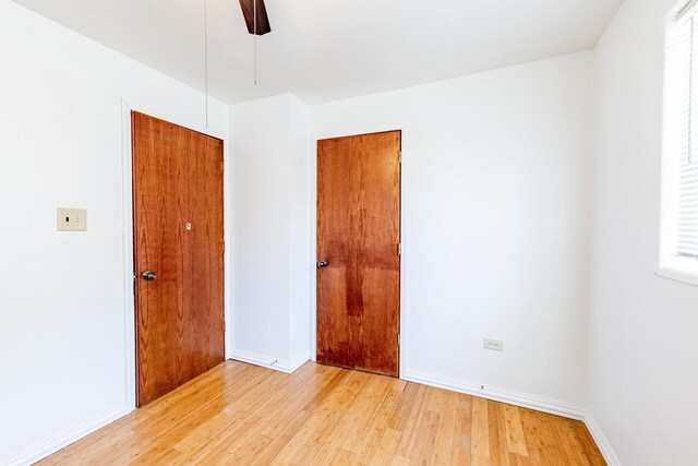 14732 Dorchester Ave, Dolton, IL 60419 - empty room featuring light wood-style floors and ceiling fan