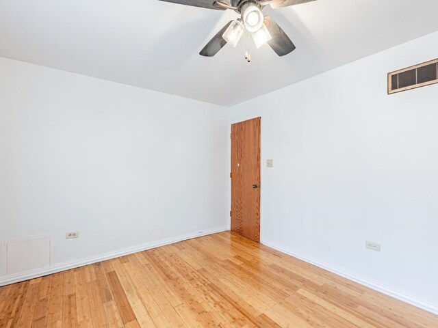 14732 Dorchester Ave, Dolton, IL 60419 - unfurnished room with light wood finished floors and a ceiling fan