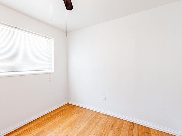 14732 Dorchester Ave, Dolton, IL 60419 - spare room with light wood-type flooring and ceiling fan