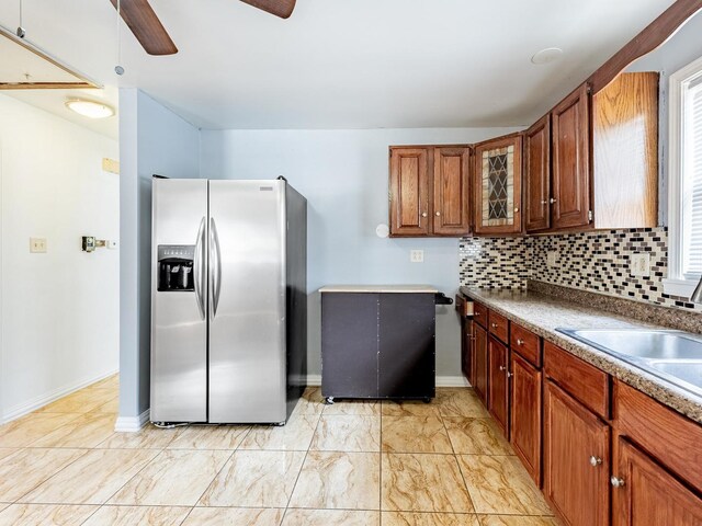 14732 Dorchester Ave, Dolton, IL 60419 - kitchen with stainless steel fridge with ice dispenser, a ceiling fan, glass insert cabinets, backsplash, and brown cabinetry