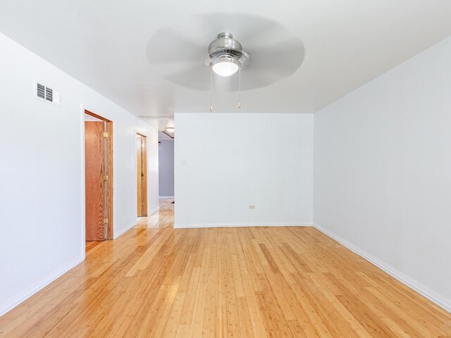 14732 Dorchester Ave, Dolton, IL 60419 - spare room with light wood finished floors and ceiling fan