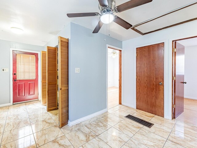 14732 Dorchester Ave, Dolton, IL 60419 - unfurnished bedroom featuring light marble finish floors and ceiling fan