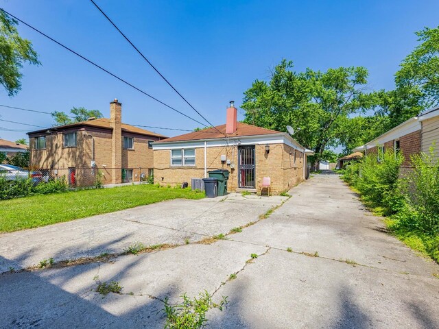 14732 Dorchester Ave, Dolton, IL 60419 - back of house featuring a chimney