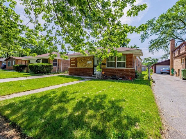 14732 Dorchester Ave, Dolton, IL 60419 - single story home with brick siding and an outdoor structure