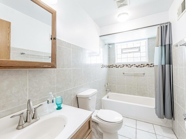 14732 Dorchester Ave, Dolton, IL 60419 - full bathroom featuring tile walls, shower / tub combo, vanity, and tile patterned floors