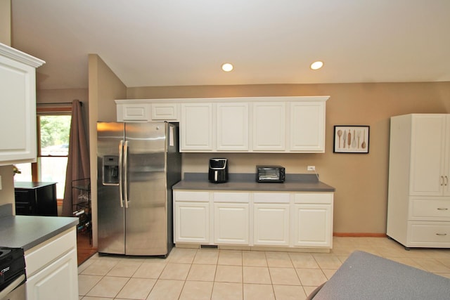 135 Miller Rd, Lake Zurich, IL 60047 - kitchen with stainless steel appliances, light tile patterned flooring, dark countertops, white cabinets, and recessed lighting