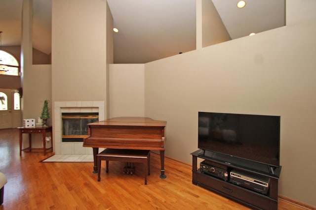 135 Miller Rd, Lake Zurich, IL 60047 - sitting room with high vaulted ceiling, wood finished floors, a fireplace, and recessed lighting