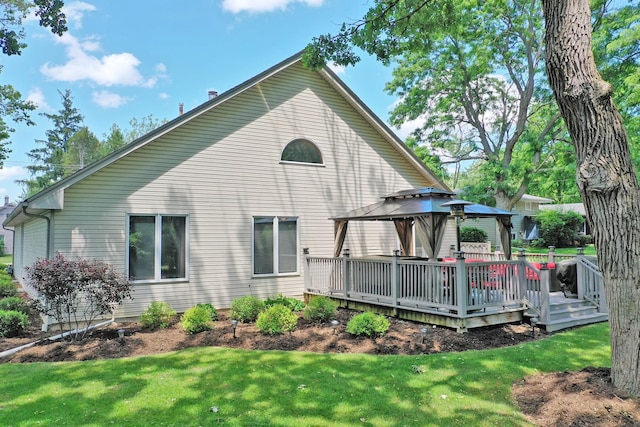 135 Miller Rd, Lake Zurich, IL 60047 - rear view of house with a gazebo, a lawn, and a deck