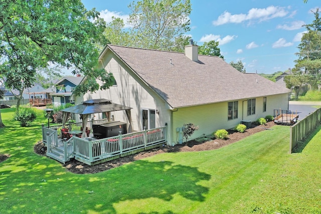 135 Miller Rd, Lake Zurich, IL 60047 - rear view of house featuring a hot tub, a wooden deck, a shingled roof, and a chimney