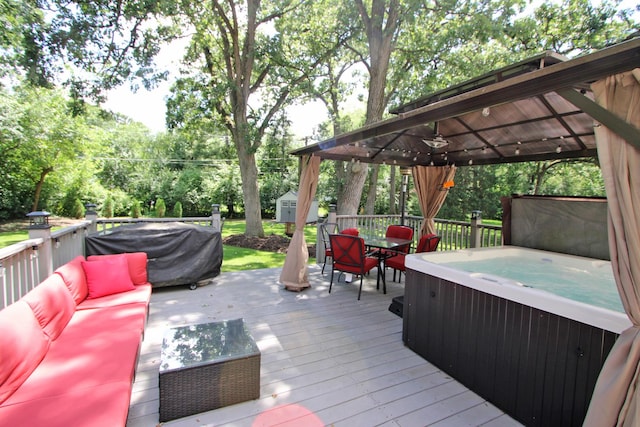 135 Miller Rd, Lake Zurich, IL 60047 - deck with a gazebo, an outdoor living space, a hot tub, outdoor dining space, and a storage shed