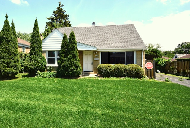 1509 Morris Ave, Berkeley, IL 60163 - view of front of home with brick siding, a shingled roof, and a chimney
