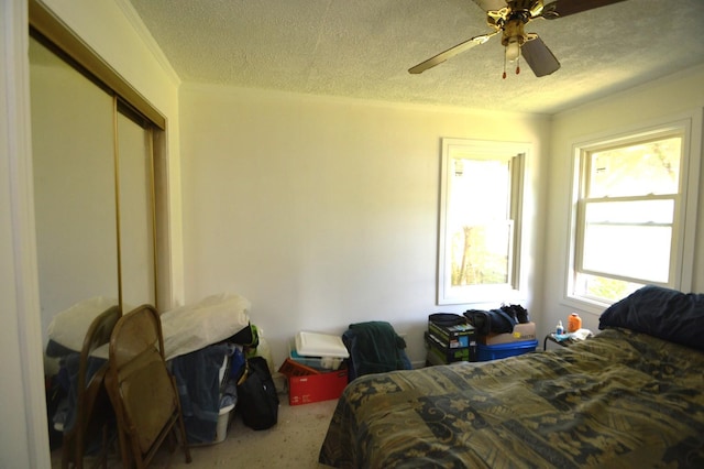 1509 Morris Ave, Berkeley, IL 60163 - bedroom with a textured ceiling, a closet, and ceiling fan