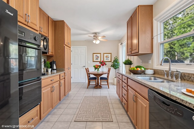 1902 N Washington St, Wheaton, IL 60187 - kitchen featuring black appliances, light stone countertops, ceiling fan, and light tile patterned floors