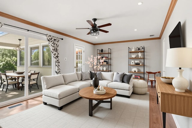 1902 N Washington St, Wheaton, IL 60187 - living room with light wood-style floors, ceiling fan, recessed lighting, and ornamental molding