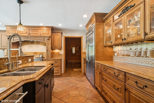 10305 Ridge Ln, Huntley, IL 60142 - kitchen featuring appliances with stainless steel finishes, backsplash, decorative light fixtures, recessed lighting, and brown cabinetry