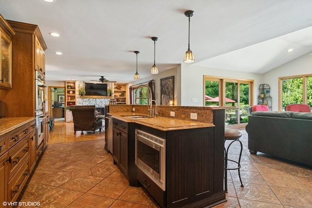 10305 Ridge Ln, Huntley, IL 60142 - kitchen featuring open floor plan, appliances with stainless steel finishes, a kitchen breakfast bar, recessed lighting, and an island with sink