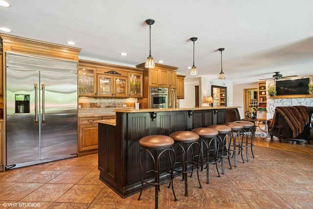 10305 Ridge Ln, Huntley, IL 60142 - bar with stainless steel appliances, recessed lighting, hanging light fixtures, tasteful backsplash, and a ceiling fan