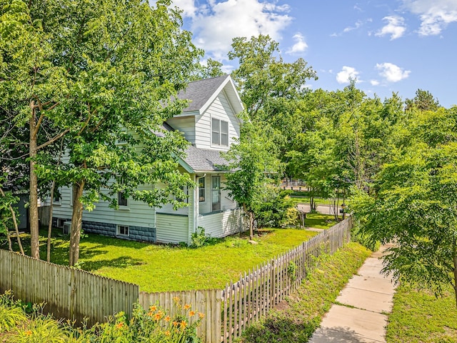 2242 S 5th St, Rockford, IL 61104 - view of side of property with roof with shingles