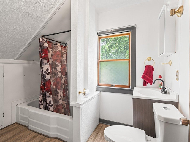 2242 S 5th St, Rockford, IL 61104 - full bath featuring wood finished floors, a textured ceiling, shower / bathtub combination with curtain, and vanity
