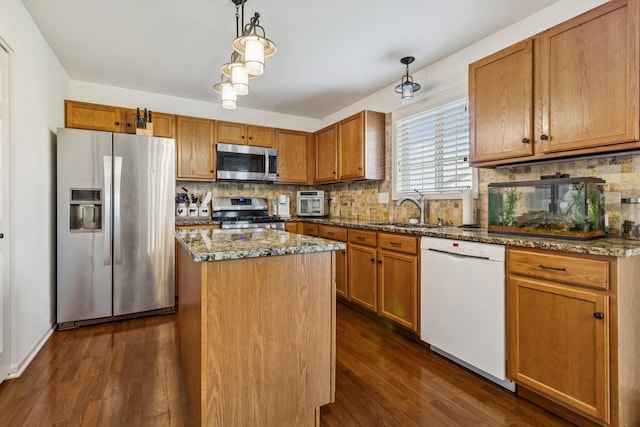 774 Dover St, Pingree Grove, IL 60140 - kitchen featuring stainless steel appliances, dark wood-style flooring, decorative backsplash, and a kitchen island
