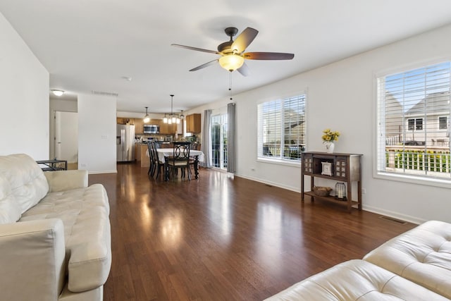 774 Dover St, Pingree Grove, IL 60140 - living area featuring a ceiling fan, dark wood-style floors, and a chandelier